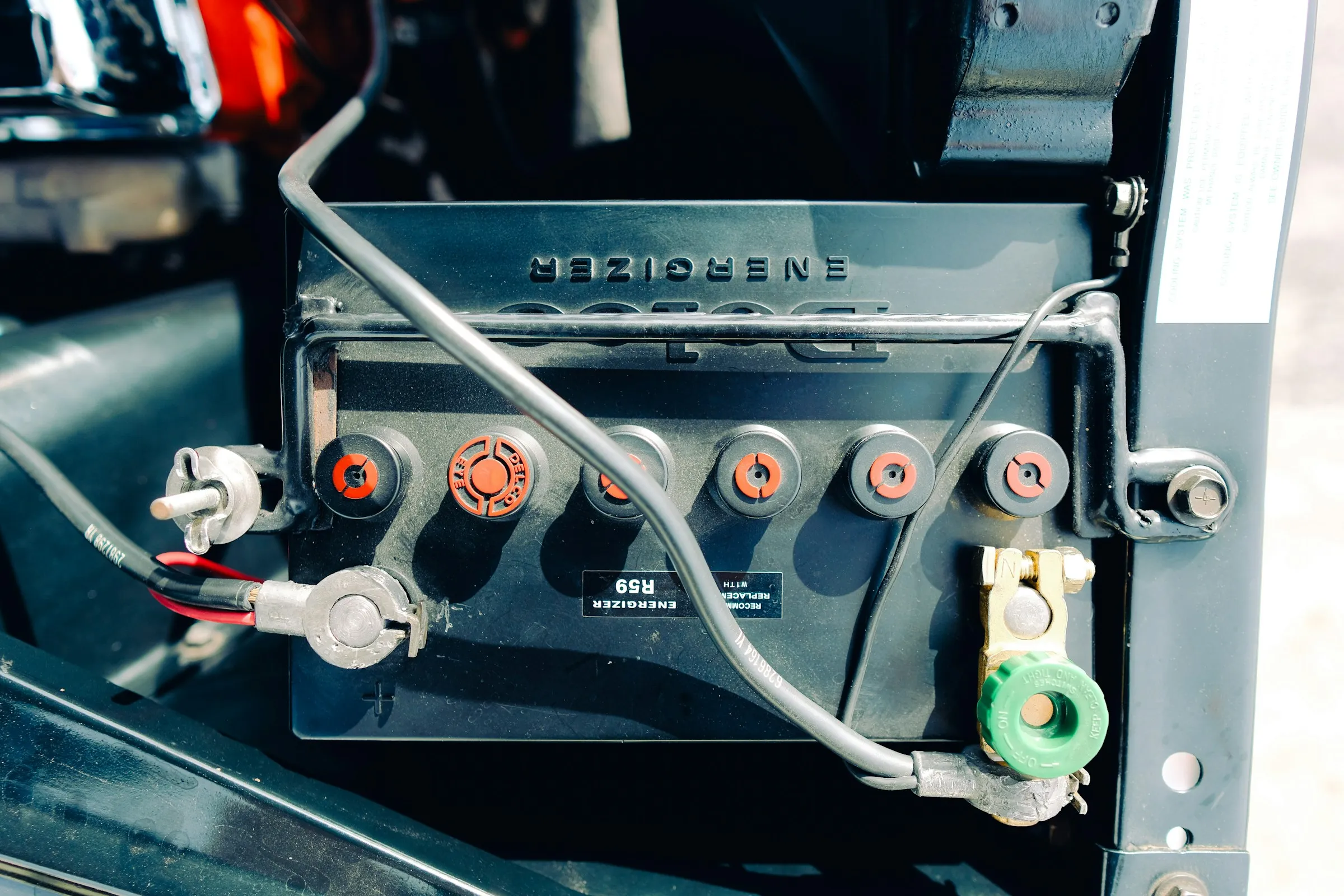 Close-up of a car battery with the cables connected